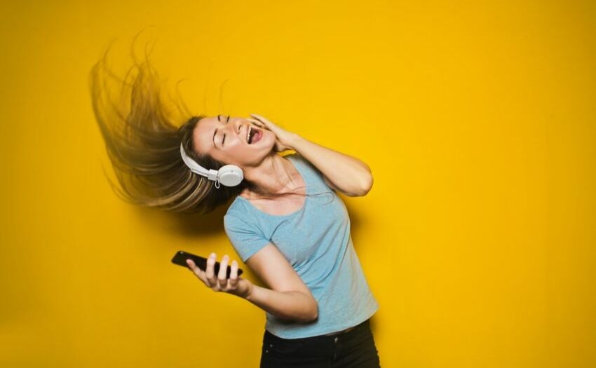 woman wearing headphone singing