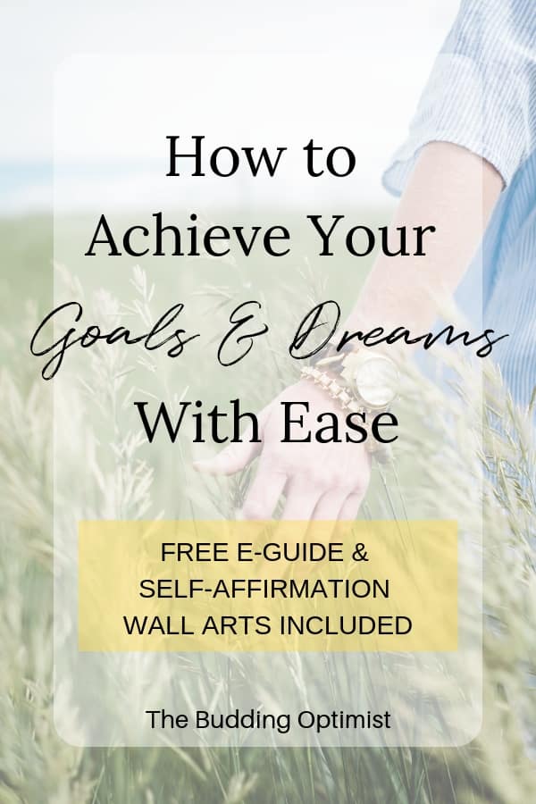How to achieve your goals and dreams Pinterest image - hand brushing through grass