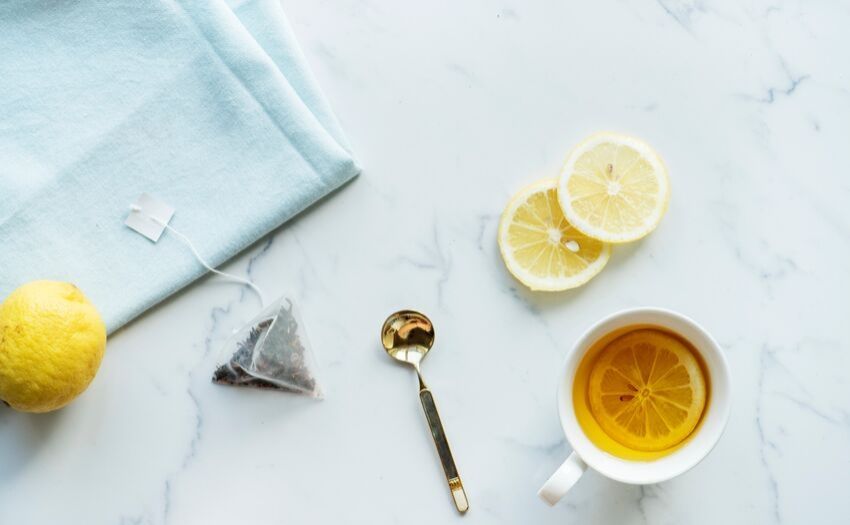 Natural cold remedies - woman holding a cup of tea