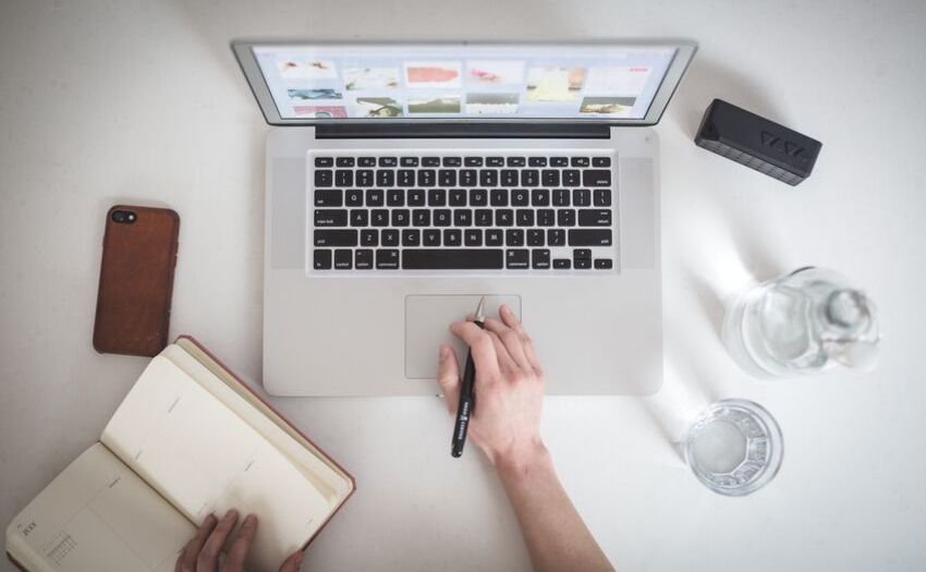 Job application mistakes - hand typing on computer keyboard