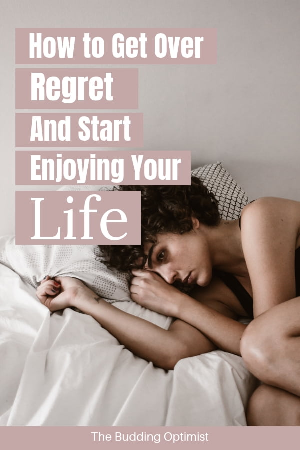 How to get over regret Pinterest - sad woman lying on bed-min