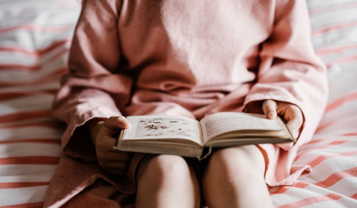 Woman sitting with a book in her lap