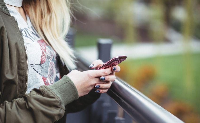 woman texting on her phone
