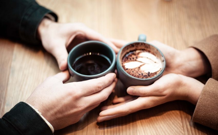 rainy day date ideas indoors couple having coffee together