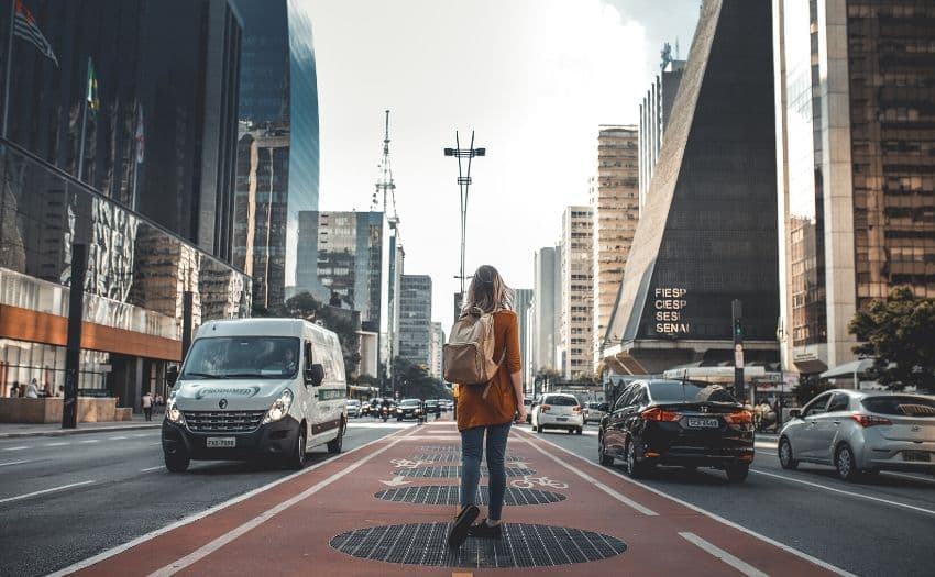 woman walking on a busy street