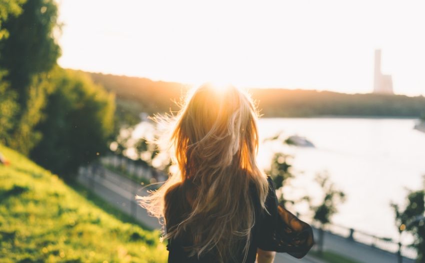 woman standing under the sun