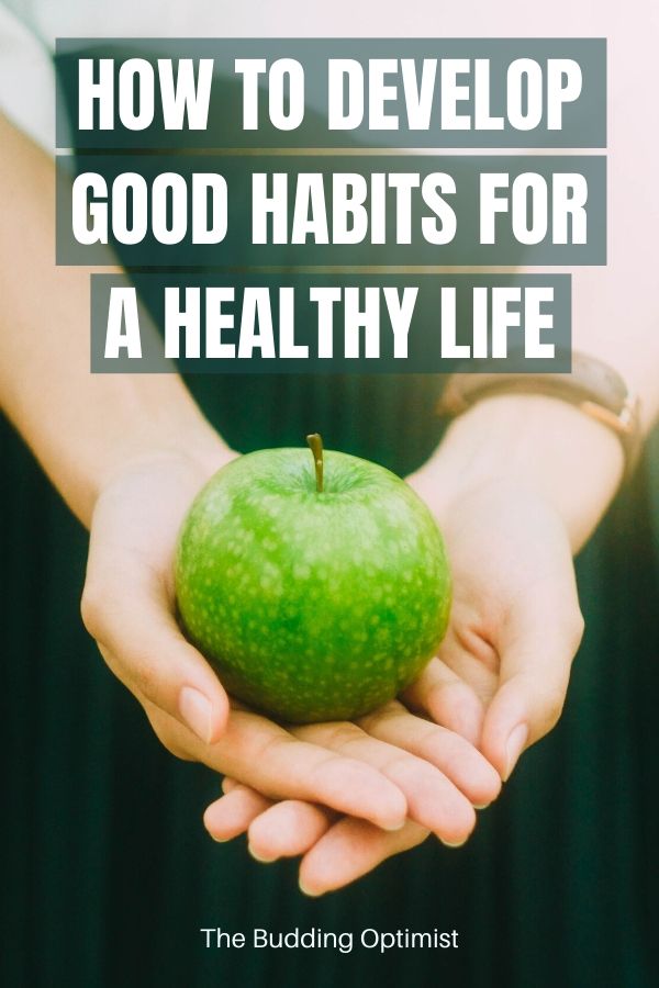 healthy habits to start now Pinterest image a hand holding up a green apple