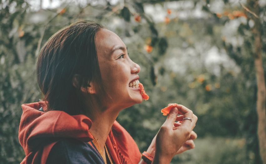 woman happily eating 
