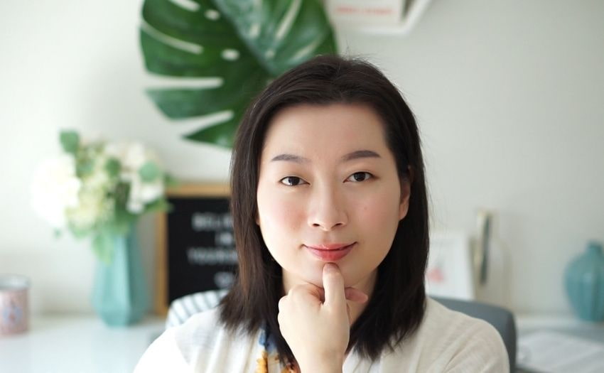 Sabrina demonstrating where to find the Chengjiang facial acupressure point